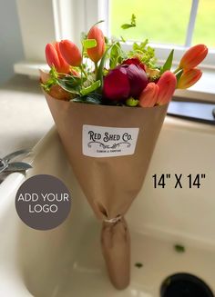 a bouquet of flowers sitting on top of a sink