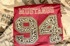 a red bandana with the number 94 printed on it and leopard print in the middle