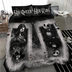 a bed with two sheets that have pictures of jack skellingy and the skeleton king on them