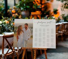 an easel with a wedding seating plan on it