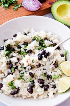 a white bowl filled with rice and black beans