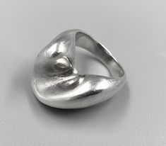 "A wonderful sterling silver modernist ring with smooth, flowing lines.  The ring measures almost 3/8\" high from the finger, and weighs 11 grams. Beautiful quality, the design is very distinct, edges smooth and a very solid feel.  There are no markings on the ring, but it has been appraised and tested as .925 Sterling.  Current ring size: 5.5  Statistics: Size 5.5 Weight: 11 Grams Metal:  Sterling Purity:  .925" Modernist Ring, Unusual Rings, Clay Teapots, Modernist Jewelry, Wedding Vases, Contemporary Ring, Stacked Jewelry, Wave Design, Ring Collections