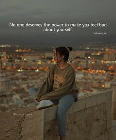 a woman sitting on top of a stone wall with a quote above her that reads, no one deserves the power to make you feel bad about yourself