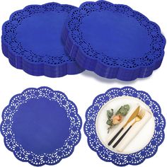 blue placemats and plates with goldware on them