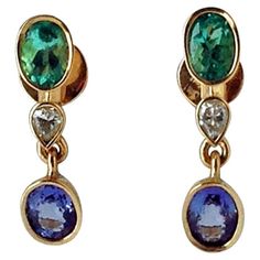 4.55 Carat Colombian Emerald Tanzanite and Diamond Drop Dangle Earrings 18K This ELEGANT pair of earrings feature two natural Colombian Emerald oval cut 1.75ct medium light green VS, two natural diamond pear cut 0.50ct VS and two natural Tanzanite oval cut 2.30ct/VS. Total gemstone weight: 4.55 carats Weight: 6.28g Composicin: Solid 18K yellow gold Measurements: 26.86mm x 6.37mm Condition: New All gemstone and diamonds are 100% natural Victorian Drop Earrings, Color Verde Claro, Emerald Earrings Drop, Art Earrings, Diamond Dangle Earrings, Colombian Emeralds, Natural Tanzanite, White Gold Earrings, Diamond Drops