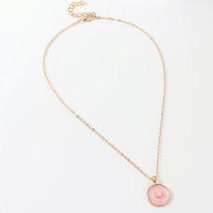 A must-have: handmade oil dripping pendant with a modern chic flair.A delicate chain holds this uneven coin featuring a new moon symbol, believed to empower important work decisions.Matching earrings and ring sold separately.Material: 14K gold plated copper.Length: 16"Chain extender: 2" Everyday Rose Gold Coin Pendant Jewelry, Rose Gold Circle Jewelry With Adjustable Chain, Rose Gold Circular Jewelry With Adjustable Chain, Rose Gold Brass Charm Necklace With Round Pendant, Rose Gold Plated Jewelry With Moon Charm, Pink Moon Charm Jewelry, Pink Round Moon Charm Jewelry, Moon Symbol, Moon Symbols