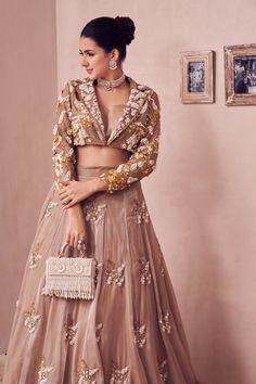 When the ‘It’ girl in you needs a new lehenga! A blazer-inspired blouse with spectacular pearl embellishment and a ghera to match the beauty, only from Swish by Dolcy and Simran!

Visit our website now!
www.swishbydolcyandsimran.com Wedding Outfits Bridesmaid, Fitted Long Sleeve Choli For Wedding, Formal Fitted Long Sleeve Choli, Long Sleeve Lehenga With Sheer Dupatta, Formal Long Sleeve Lehenga With Zari Work, Wedding Sets With Unstitched Long Sleeve Blouse, Fitted Beige Set For Reception, Formal Fitted Lehenga With Sheer Dupatta, Elegant Long Sleeve Organza Choli