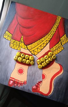 a painting with gold colored beads on it's legs and feet in front of a red background