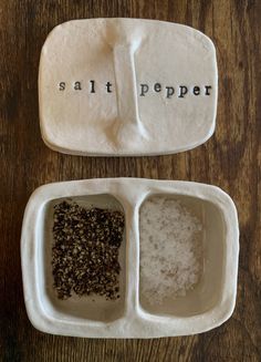 salt and pepper are in separate dishes on the table