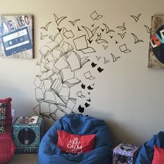 a room with bean bag chairs and pictures on the wall