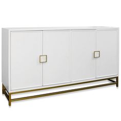 a white cabinet with gold handles and two doors