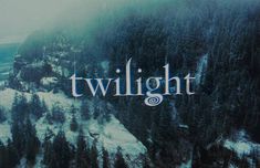 the title for twilight is shown in front of snow covered mountains