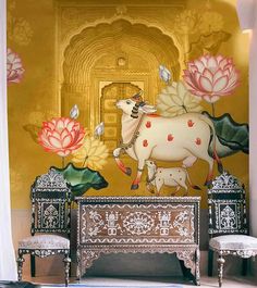 an artistic painting on the side of a wall with flowers and a cow in front of it