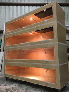 a large wooden shelf sitting inside of a warehouse