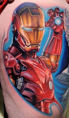 a man with a tattoo on his stomach that has iron man and spider - man in it