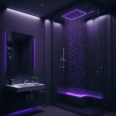 a bathroom with purple lighting in the shower