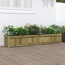 two wooden planters sitting on top of a hard wood floor next to a white wall