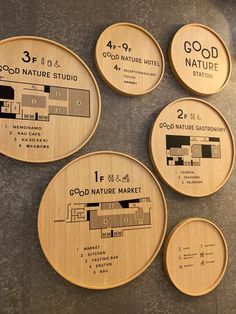 four wooden coasters with numbers and names on them