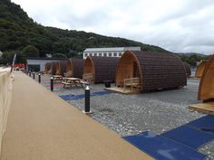 there are many wooden boats on the beach