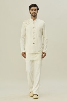 Ivory, white sleeveless bundi with pearl, sequin placement embroidery in floral pattern. Paired with full sleeve kurta and pyjama. - Aza Fashions Designer Wear Fitted White Nehru Jacket, Designer White Fitted Nehru Jacket, Designer Fitted White Nehru Jacket, White Fitted Nehru Jacket For Designer Wear, White Sleeveless Nehru Jacket With Resham Embroidery, Designer Nehru Jacket In Off White, Off White Nehru Jacket For Eid Reception, Designer Off-white Fitted Nehru Jacket, Fitted Off White Nehru Jacket For Designer Wear