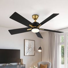 a living room with a ceiling fan in it