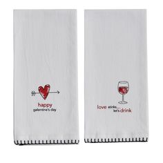 two white towels with wine glasses on them and the words happy valentine's day