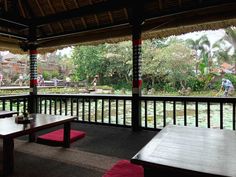 an outdoor seating area with tables and benches