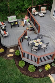 an aerial view of a deck with patio furniture and outdoor dining area in the background