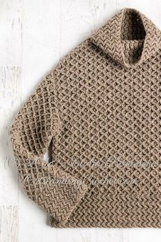 the sweater is knitted and ready to be used as a coat or topper