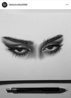 a pencil drawing of an eye with long lashes