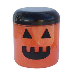 an orange canister with a jack - o'- lantern face on it