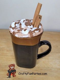 a cup filled with hot chocolate and marshmallows