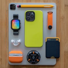 an assortment of electronics and gadgets laid out on top of a tabletop next to each other