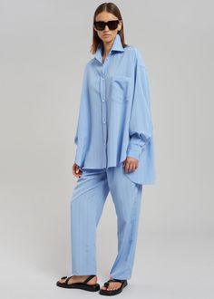 Color: Powder BlueLightweight fluid fabricRelaxed straight leg silhouettePleat front detailPressed creaseSlant hip pocketsHook and bar closureBelt loops100% PolyesterDry CleanBy The Frankie Shop. Imported Oversized Wide Leg Straight Pants For Work, Blue Straight Hem Lounge Pants, Blue Straight Hem Loungewear Pants, Blue Straight Hem Pants For Loungewear, Blue Workwear Bottoms With Straight Hem, Blue Bottoms With Straight Hem For Work, Blue Straight Hem Bottoms For Work, Oversized Straight Work Pants, Straight Hem Pants With Pockets For Daywear