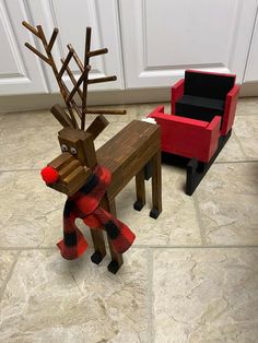 two chairs and a table made to look like reindeers