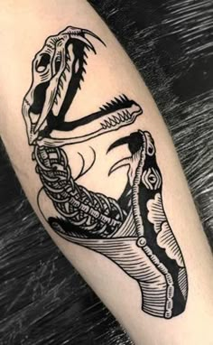 a black and white tattoo design of a dinosaur