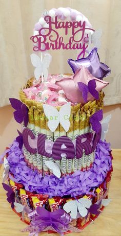 a birthday cake made out of candy and candies with the words happy birthday on top