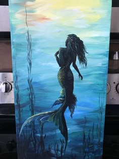 a painting of a mermaid with long hair standing in the water and holding her hands behind her back