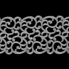 an intricate metal design on a black background