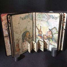 an open book with playing cards in it