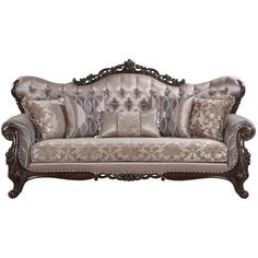 an ornate couch with pillows on it