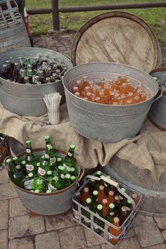 several buckets filled with different types of food