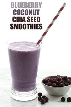 blueberry coconut chia seed smoothie in a glass with a striped straw next to it