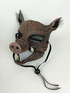 Handmade resin Wild Boar costume mask. Creepy Hog mask for Halloween or theatrical production. Durable resin, Comfortable & lightweight, will fit adult, teen and child. One available, ready to ship. Stunning handcrafted Hog Mask, perfect for theatre and ballet, specifically designed for the stage. Professional, full-face, costume mask. Realistic Boar face, sculpted with fur texture, menacing tusks and large ears with faux fur.  Key Features: ★ 3 way, adjustable elastic straps ensure a secure fit Themed Mask Costume Accessories For Fantasy Events, Themed Costume Mask For Fantasy Events, Halloween Fantasy Mask Costume, Themed Mask For Fantasy Events, Halloween Fantasy Event Mask Costume, Adjustable Masks And Prosthetics For Cosplay Events, Plastic Costume Accessories For Halloween Cosplay, Plastic Costume Accessories For Cosplay Halloween, Plastic Halloween Cosplay Costume Accessories