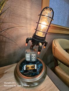 a lamp sitting on top of a table next to a chair