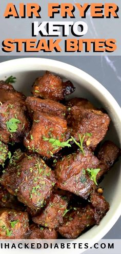 a white bowl filled with steak bites and garnished with parsley