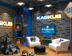 the interior of a store with furniture and sports balls on the wooden floor, as well as an advertisement for kaskus