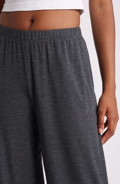 Whisper light and stretchy, these finely ribbed pants with a flowy, wide-leg silhouette are a dreamy soft addition to your bedtime routine. 30" inseam; 26" leg opening; 13" front rise; 13" back rise (size Medium) Elastic waist 59% polyester, 32% viscose, 9% spandex Machine wash, tumble dry Imported Seamless Long Pants For Loungewear, Stretch Ribbed Wide Leg Pants, Modal Bottoms For Relaxation, Modal Bottoms For Sleep, Comfortable Seamless Bottoms For Loungewear, Solid Color Ribbed Wide Leg Pants, Casual Seamless Loungewear Pants, Stretch Modal Bottoms For Relaxation, Stretch Ribbed Wide Leg Loungewear Pants