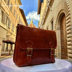 This Italian leather satchel bag is a testament to exquisite craftsmanship and timeless elegance. Handmade in Florence, Italy, using the finest genuine leather, it combines premium quality, luxury, and modern Italian fashion. Elevate your style with this meticulously crafted accessory that exudes sophistication and showcases the rich heritage of Italian craftsmanship. Experience the perfect blend of functionality and style with our Italian Handmade Leather Satchels Bags for Men. . Size: Width:32cm/12.6 inch Height:26cm/10.4 inch Depth: 10cm/4 inch  . The story of this bag: Once upon a time in the picturesque city of Florence, Italy, skilled artisans dedicated their lives to the art of leather craftsmanship. In their humble workshops, they meticulously handcrafted satchel bags with utmost p High-end Brown Business Shoulder Bag, High-end Business Shoulder Bag Briefcase, High-end Business Briefcase Shoulder Bag, Designer Cognac Satchel With Leather Lining, High-end Brown Satchel For Formal Occasions, High-end Brown Formal Satchel, High-end Brown Rectangular Briefcase, Formal Vegetable Tanned Leather Shoulder Bag, High-end Brown Satchel Briefcase