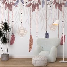 a living room with a chair, plant and wallpaper